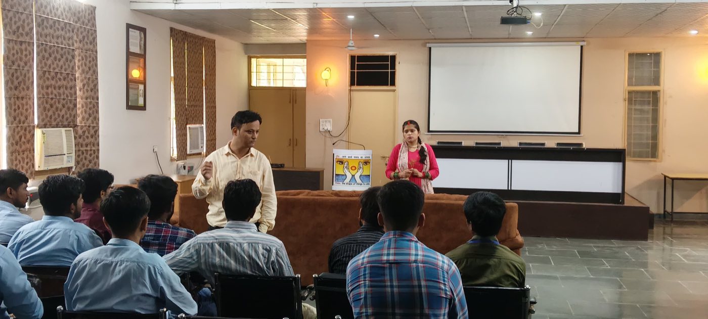 Two faculty members leading a session with students in the VCM seminar hall