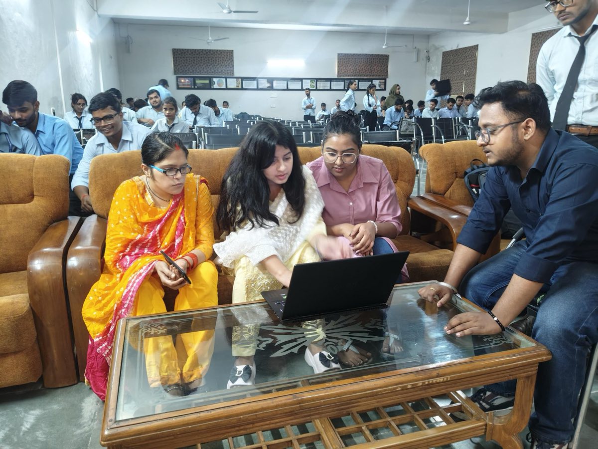 Work being reviewed on a laptop in the VCM seminar hall
